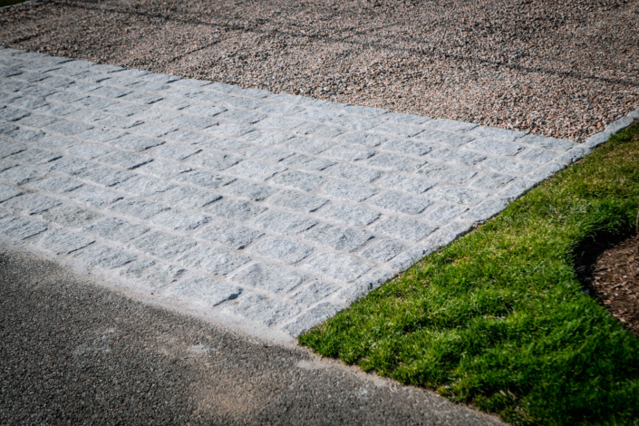 Crushed stone driveway with a cobblestone apron in Jamestown, Rhode Island.